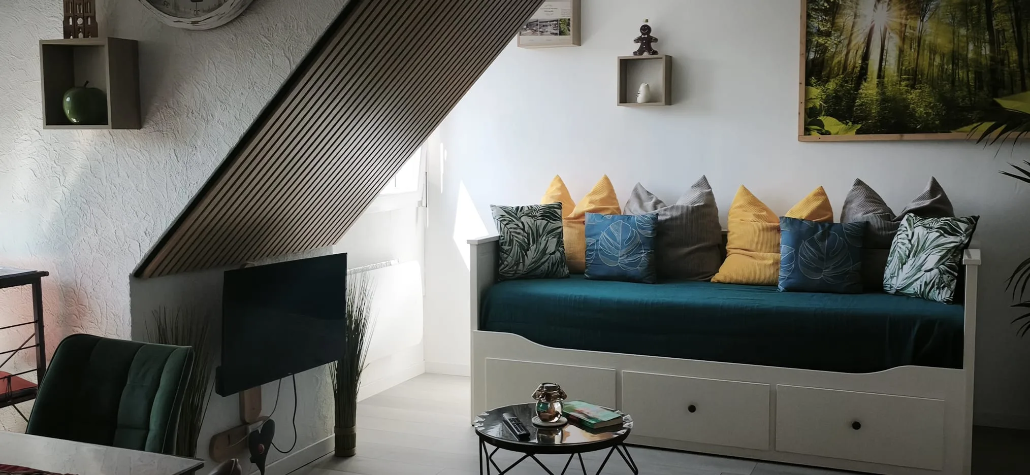 Sofa bed and living area of L'Obernai, nature theme